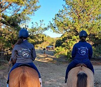 Two riders with farm jackets